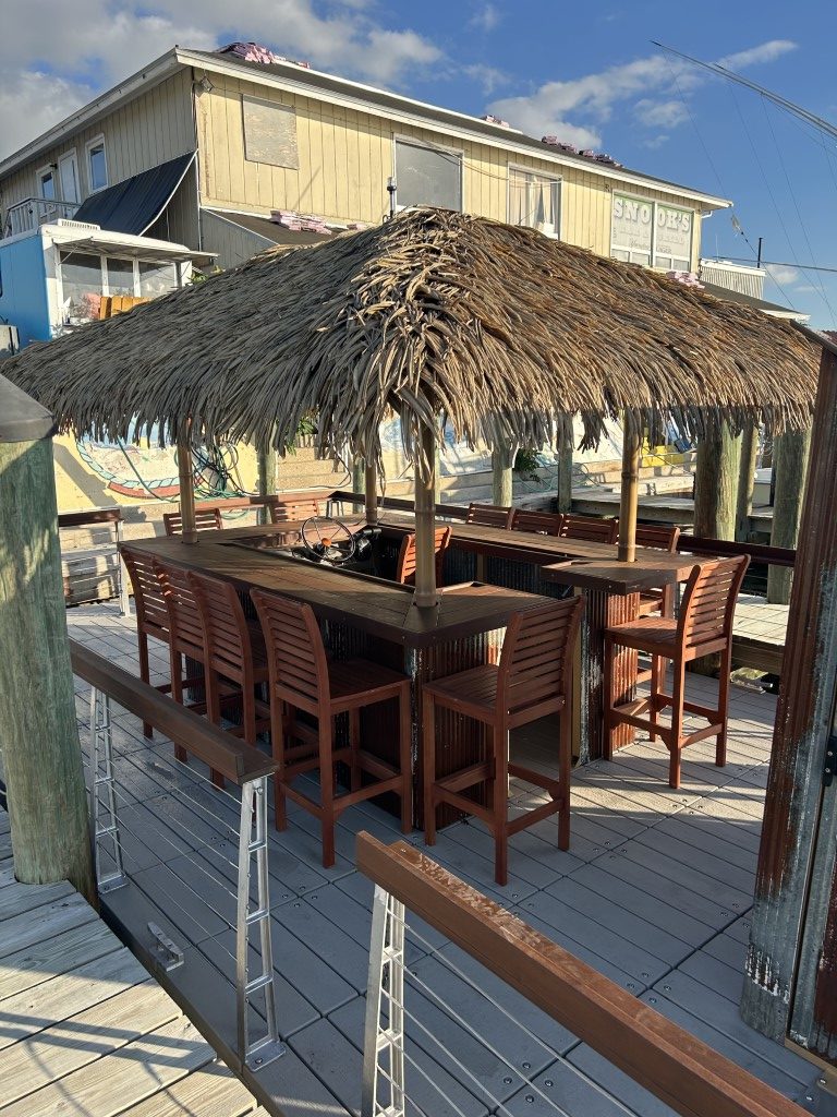 Open seating area on docked tiki boat near Long Beach Island marina