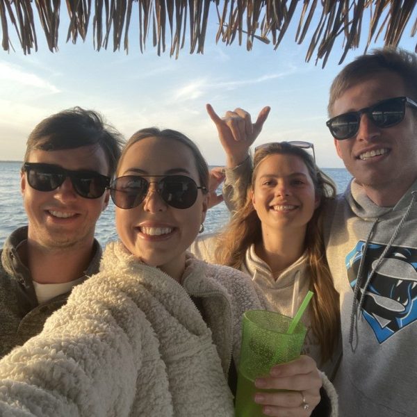 Group selfie during a sunset tiki boat ride on Long Beach Island