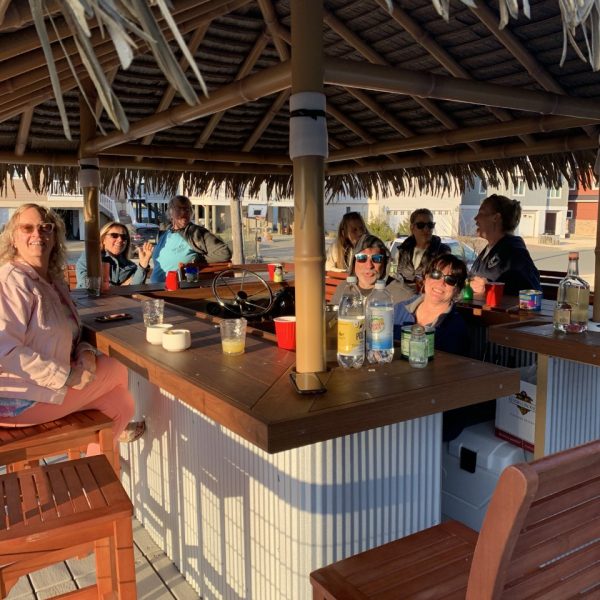 thumbnail_IMG_1104 Guests enjoying drinks and conversation around the bar on the tiki boat